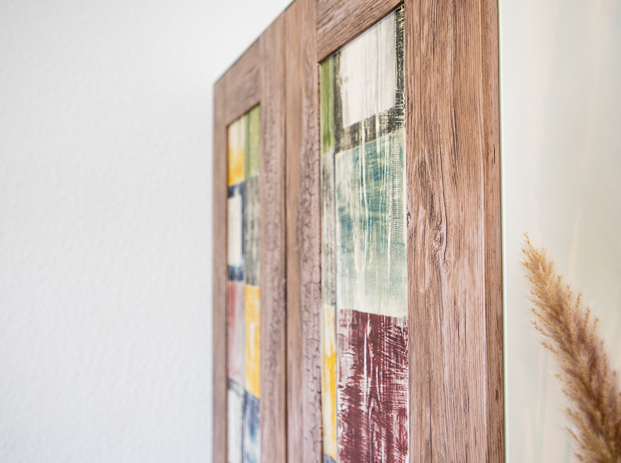 Doors of closet pasted with adhesive foils in colorful vintage look and wood look similar to a beach house.